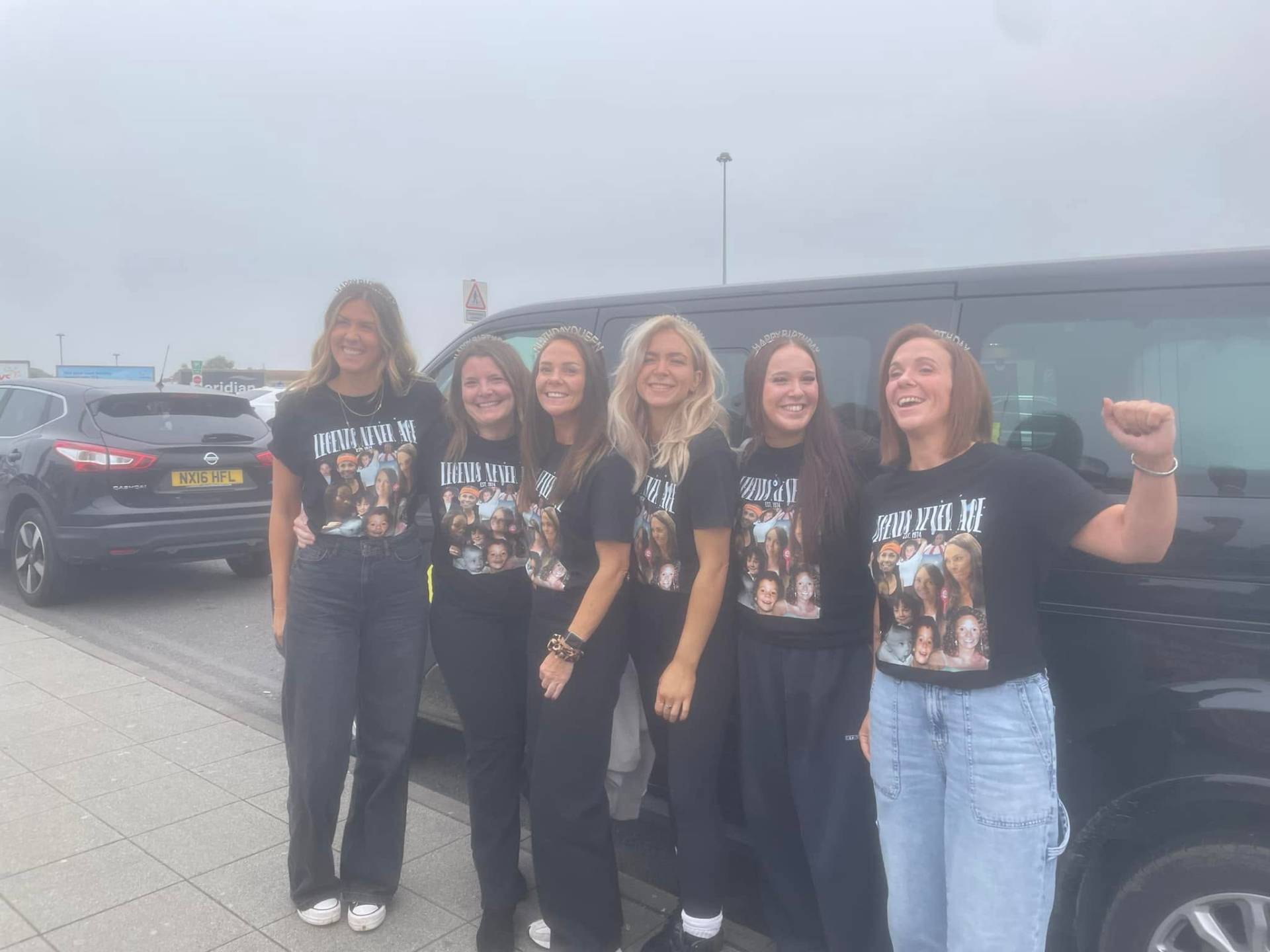 Birthday group in matching t-shirts by the van on the way to the airport