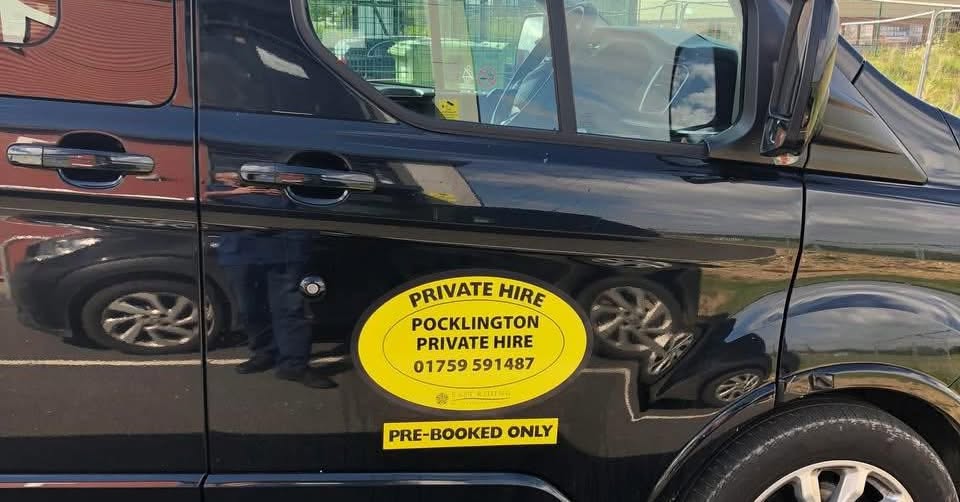 Licensed private hire badge on the vehicle side